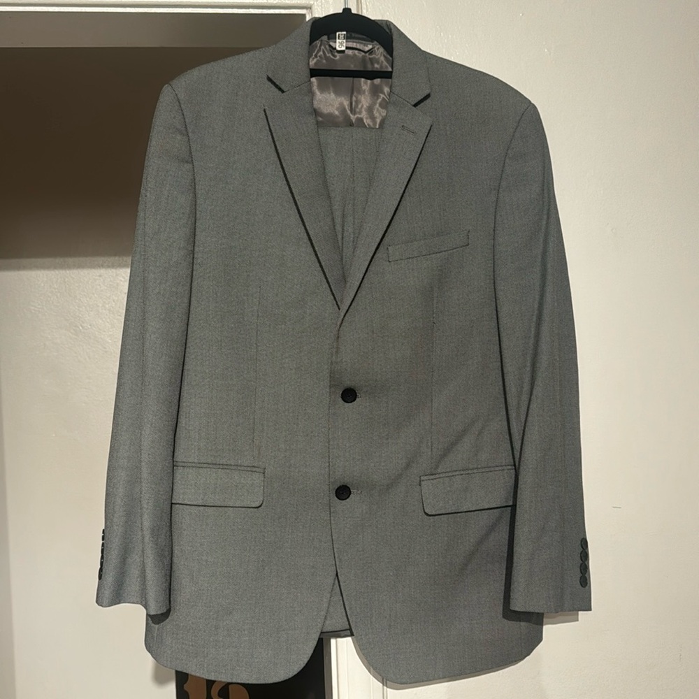 This is a 2 piece men suit. The suit is a grey 40R/34R suit.